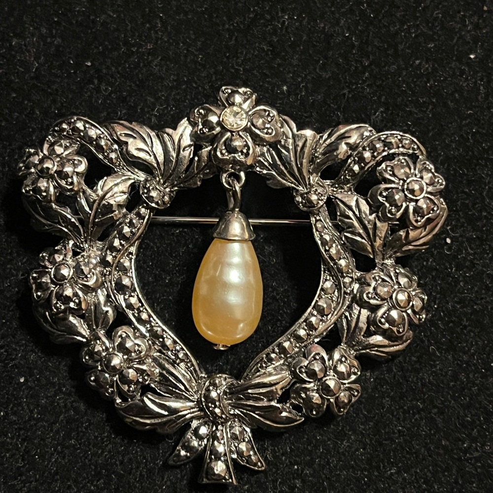 Elegant Silver Floral Brooch with Gold Accent